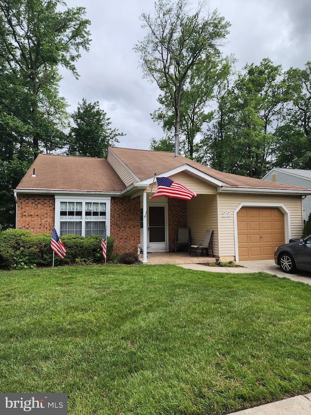 22 Kelly Dr, Deptford, NJ 08096 - ranch-style house featuring a garage, a front yard, brick siding, and driveway
