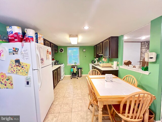9939 Wingtip Rd, Philadelphia, PA 19115 - kitchen featuring white appliances, dark brown cabinets, light tile patterned flooring, light countertops, and recessed lighting