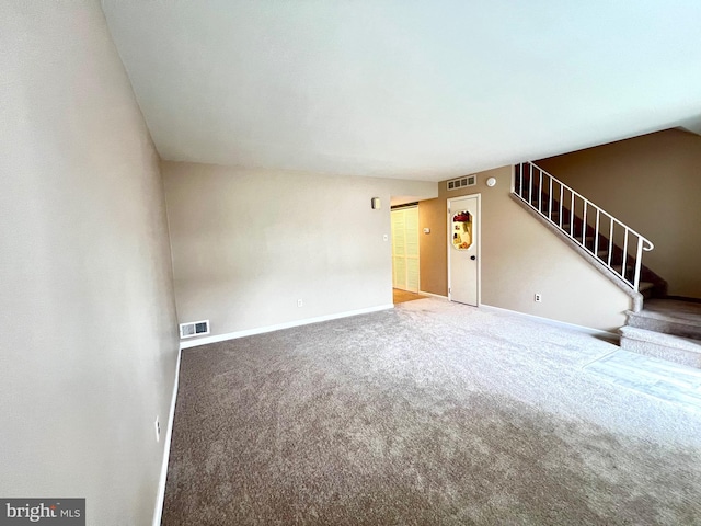 9939 Wingtip Rd, Philadelphia, PA 19115 - unfurnished living room with stairway, carpet flooring, and baseboards