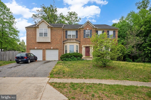 10005 Westerly Ln, Fort Washington, MD 20744 - view of front of property with driveway, brick siding, and an attached garage