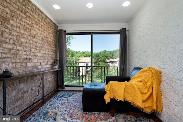 7708 Hanover Pkwy Unit 303, Greenbelt, MD 20770 - sitting room featuring wood finished floors, ornamental molding, and recessed lighting