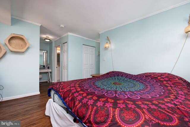 7708 Hanover Pkwy Unit 303, Greenbelt, MD 20770 - bedroom featuring dark wood-style floors, ornamental molding, and baseboards