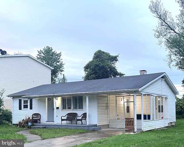 126 Cherry St, Dover, DE 19904 - rear view of property with covered porch, roof with shingles, and a chimney