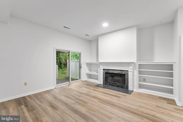 24 Beechtree Ln, Mountville, PA 17554 - unfurnished living room featuring wood finished floors, a fireplace, baseboards, and recessed lighting