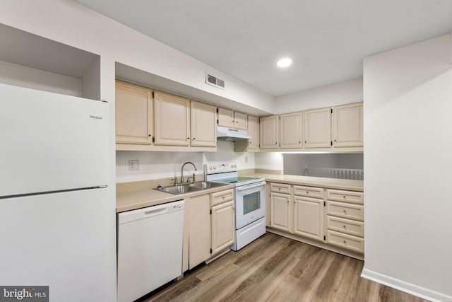 24 Beechtree Ln, Mountville, PA 17554 - kitchen with white appliances, under cabinet range hood, a sink, wood finished floors, and light countertops