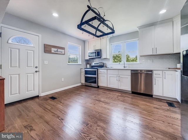 4920 Ed Mcclain Rd, Monrovia, MD 21770 - kitchen featuring stainless steel appliances, a sink, decorative backsplash, white cabinetry, and recessed lighting
