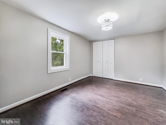 4920 Ed Mcclain Rd, Monrovia, MD 21770 - unfurnished bedroom featuring wood finished floors, baseboards, and a closet