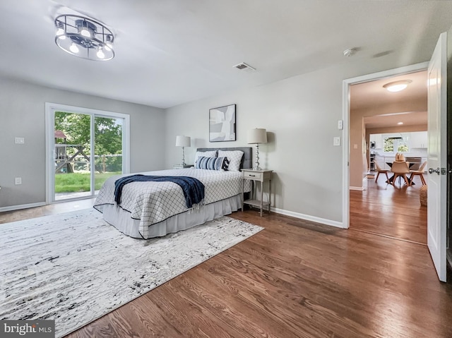4920 Ed Mcclain Rd, Monrovia, MD 21770 - bedroom featuring wood finished floors, baseboards, and access to outside
