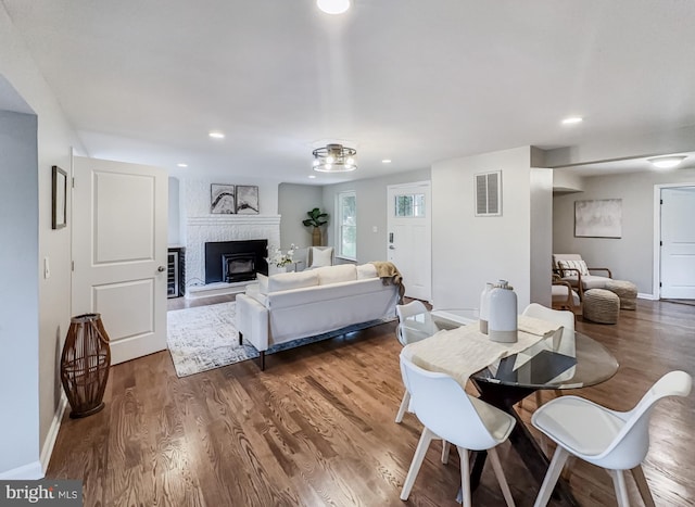 4920 Ed Mcclain Rd, Monrovia, MD 21770 - dining space featuring recessed lighting, a fireplace, wood finished floors, and baseboards