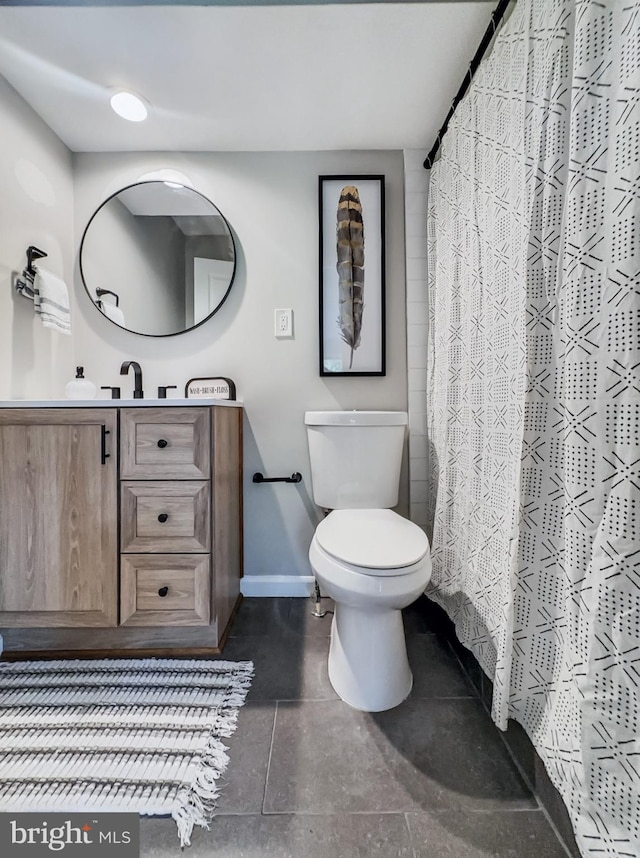 4920 Ed Mcclain Rd, Monrovia, MD 21770 - full bath with vanity, toilet, baseboards, tile patterned floors, and a shower with curtain