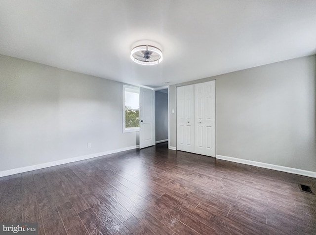 4920 Ed Mcclain Rd, Monrovia, MD 21770 - unfurnished bedroom featuring dark wood finished floors, baseboards, and a closet