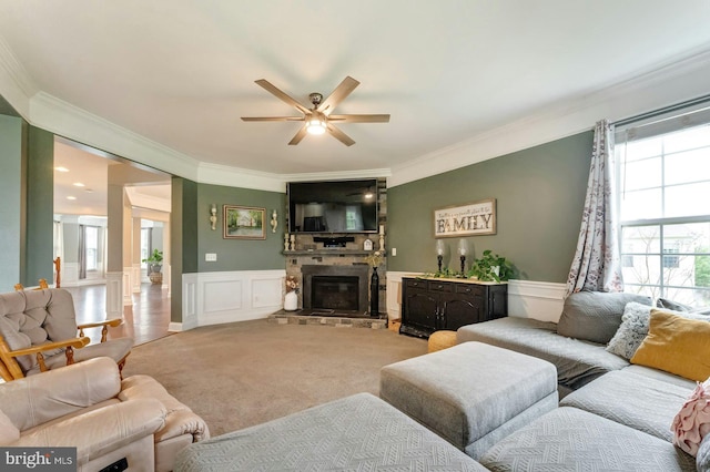 43268 Heavenly Cir, Leesburg, VA 20176 - living room featuring ornamental molding, a ceiling fan, a decorative wall, a wainscoted wall, and light carpet