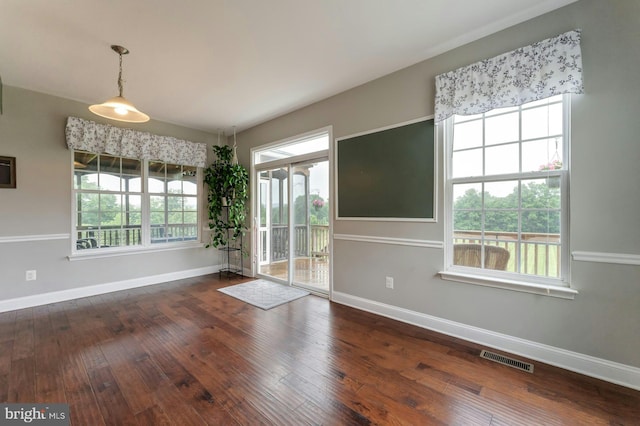 43268 Heavenly Cir, Leesburg, VA 20176 - unfurnished dining area featuring baseboards and hardwood / wood-style flooring