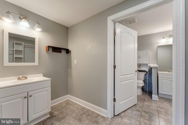 43268 Heavenly Cir, Leesburg, VA 20176 - bathroom featuring vanity, tile patterned flooring, toilet, and baseboards