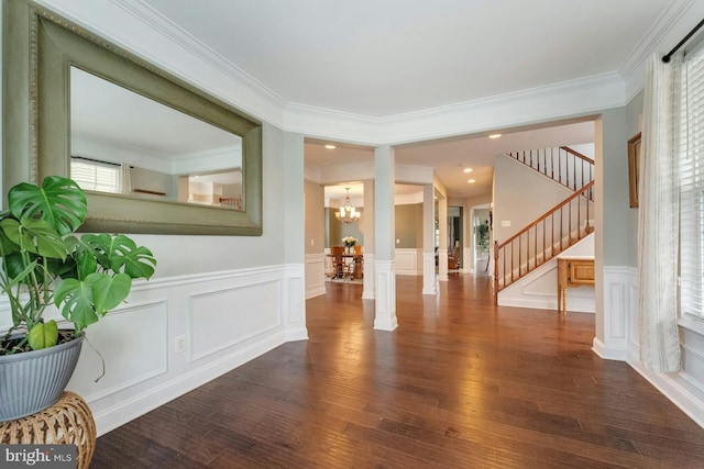 43268 Heavenly Cir, Leesburg, VA 20176 - foyer with a chandelier, dark wood finished floors, a decorative wall, stairway, and ornamental molding