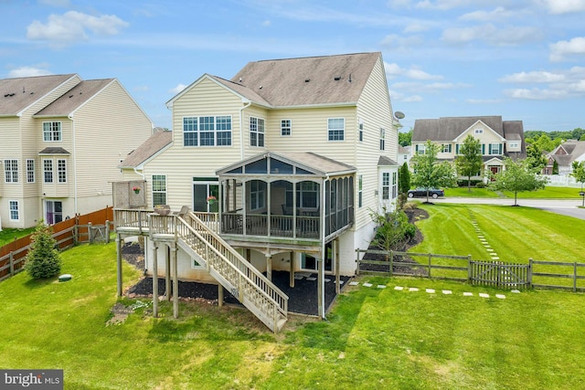 43268 Heavenly Cir, Leesburg, VA 20176 - back of house featuring a sunroom, a fenced backyard, stairs, and a residential view
