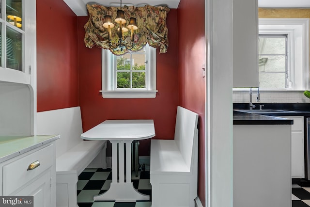 60 Old Eagle School Rd, Wayne, PA 19087 - dining area with breakfast area, tile patterned floors, and a chandelier