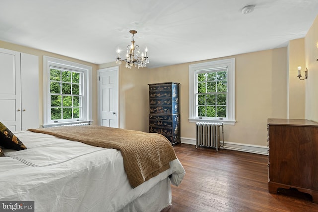 60 Old Eagle School Rd, Wayne, PA 19087 - bedroom featuring radiator heating unit, dark wood-style floors, multiple windows, and a chandelier