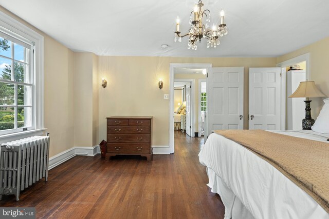 60 Old Eagle School Rd, Wayne, PA 19087 - bedroom featuring radiator, baseboards, a chandelier, and dark wood-style flooring