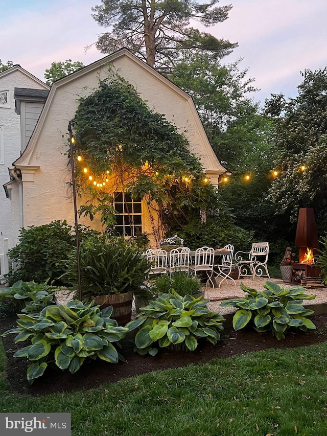60 Old Eagle School Rd, Wayne, PA 19087 - yard at dusk featuring a patio area
