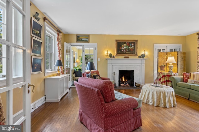 60 Old Eagle School Rd, Wayne, PA 19087 - living area with a lit fireplace, hardwood / wood-style floors, and french doors