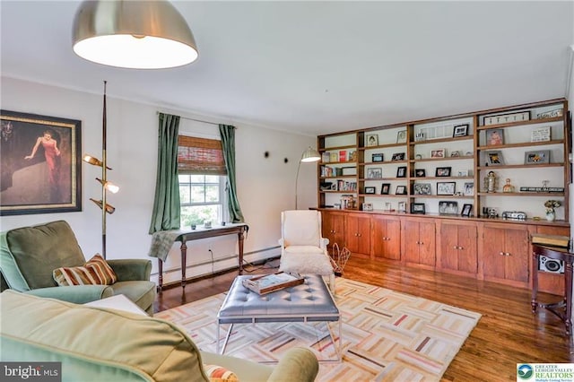 113 S Fairview St, Macungie, PA 18062 - living room featuring wood finished floors and a baseboard heating unit