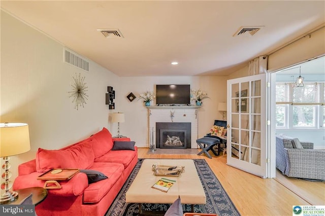 113 S Fairview St, Macungie, PA 18062 - living area with wood finished floors and a fireplace with flush hearth