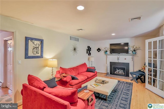 113 S Fairview St, Macungie, PA 18062 - living room with a fireplace with flush hearth, wood finished floors, and recessed lighting