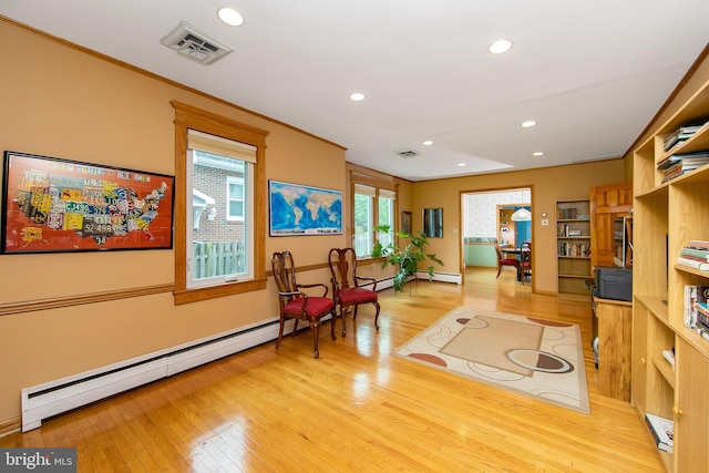 130 Bellmawr Ave, Haddon Heights, NJ 08035 - living area featuring a baseboard heating unit, light wood finished floors, recessed lighting, baseboards, and ornamental molding