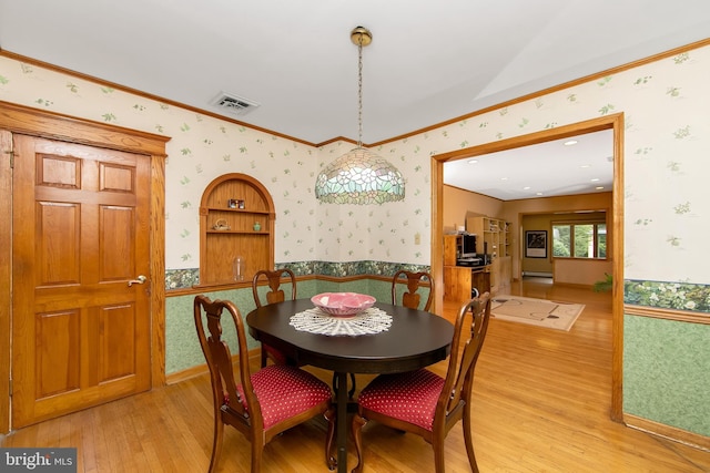 130 Bellmawr Ave, Haddon Heights, NJ 08035 - dining space with wallpapered walls, light wood-style floors, a wainscoted wall, ornamental molding, and baseboard heating