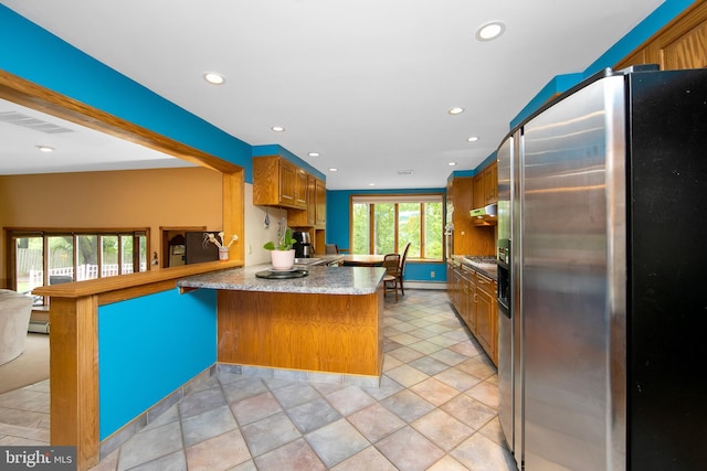 130 Bellmawr Ave, Haddon Heights, NJ 08035 - kitchen featuring stainless steel fridge, a peninsula, recessed lighting, brown cabinets, and a baseboard heating unit