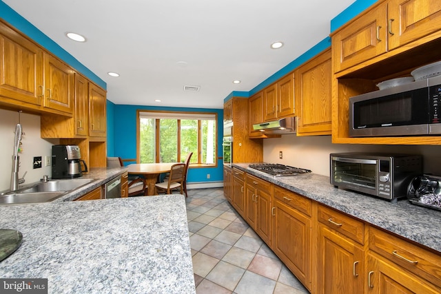 130 Bellmawr Ave, Haddon Heights, NJ 08035 - kitchen with appliances with stainless steel finishes, under cabinet range hood, light tile patterned flooring, brown cabinetry, and recessed lighting