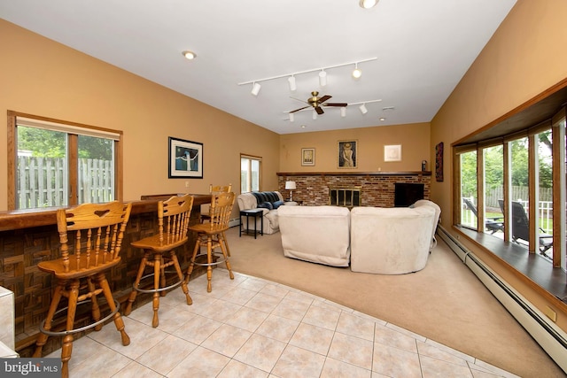 130 Bellmawr Ave, Haddon Heights, NJ 08035 - living room featuring light colored carpet, a bar, light tile patterned flooring, a ceiling fan, and a brick fireplace