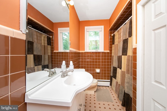 130 Bellmawr Ave, Haddon Heights, NJ 08035 - bathroom featuring tile walls, vanity, toilet, baseboard heating, and a wainscoted wall