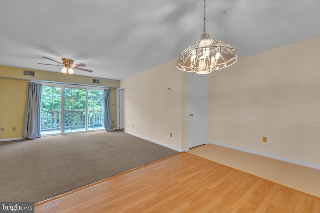 4078 Rose Bud Ct, Edinburg, VA 22824 - unfurnished room featuring ceiling fan, a chandelier, baseboards, and wood finished floors