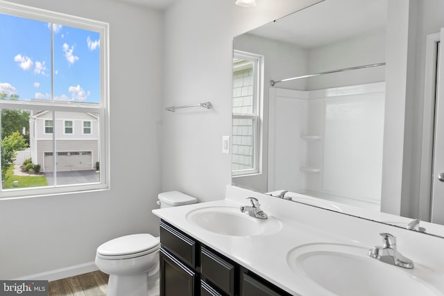 115 Shiningfield Ct, Middle River, MD 21220 - bathroom with plenty of natural light, toilet, wood finished floors, and double vanity