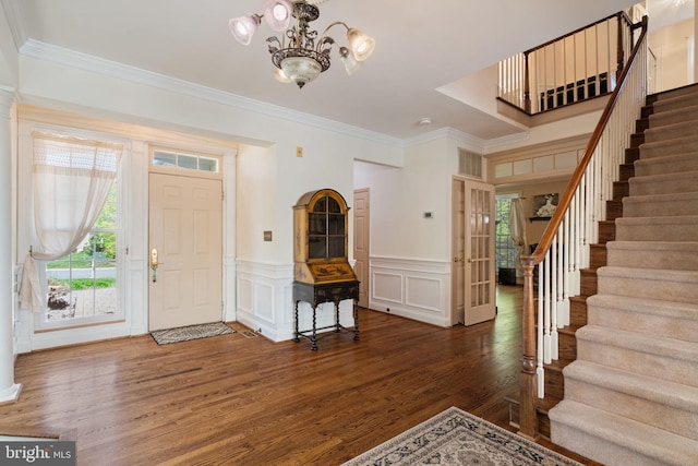 43971 Urbancrest Ct, Ashburn, VA 20147 - foyer featuring stairs, wood finished floors, ornamental molding, a chandelier, and a decorative wall
