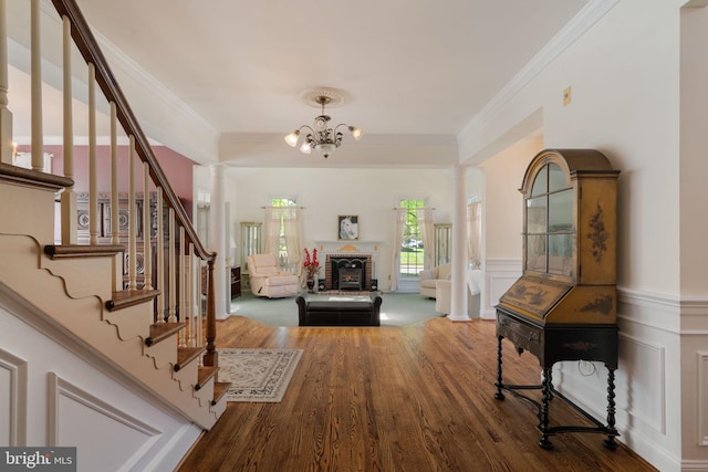 43971 Urbancrest Ct, Ashburn, VA 20147 - entryway with wood finished floors, stairway, crown molding, a chandelier, and ornate columns