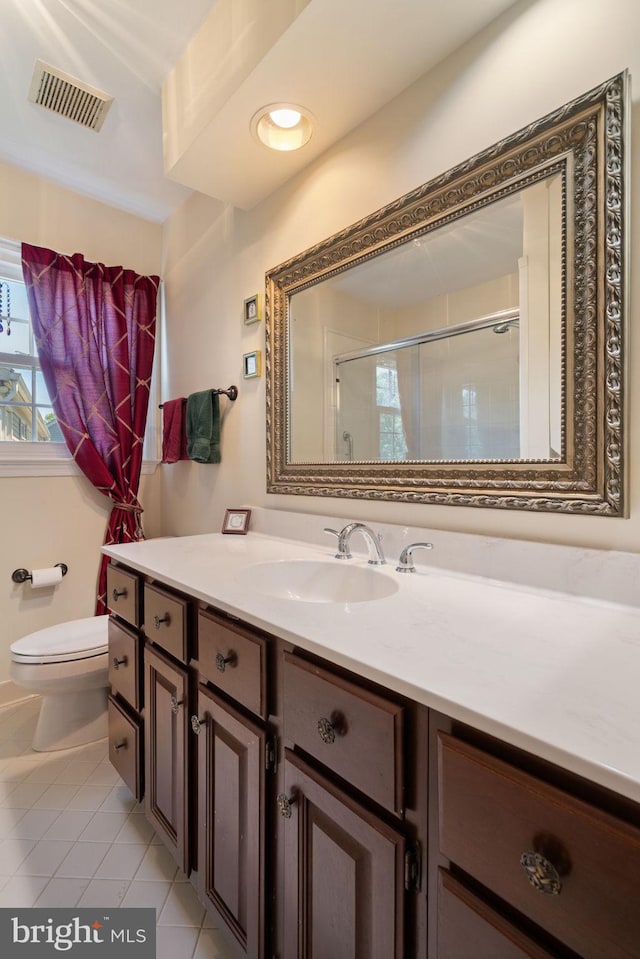 43971 Urbancrest Ct, Ashburn, VA 20147 - full bathroom with toilet, vanity, tile patterned floors, and a shower with door