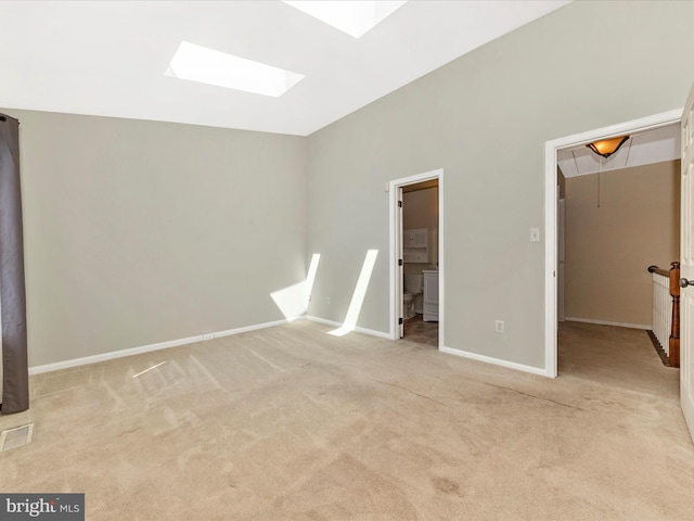 231 Coventry Sq Unit 231, Sterling, VA 20164 - unfurnished bedroom featuring a skylight, a spacious closet, carpet flooring, baseboards, and ensuite bath