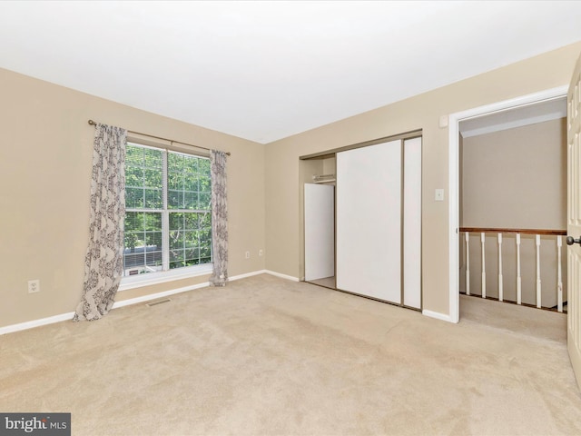 231 Coventry Sq Unit 231, Sterling, VA 20164 - unfurnished bedroom featuring baseboards, carpet, and a closet