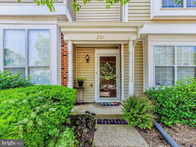 231 Coventry Sq Unit 231, Sterling, VA 20164 - property entrance featuring a porch and brick siding