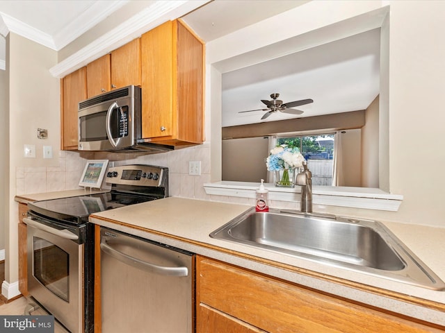 231 Coventry Sq Unit 231, Sterling, VA 20164 - kitchen with stainless steel appliances, a sink, light countertops, decorative backsplash, and a ceiling fan