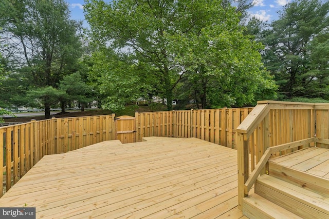 13929 Carthage Cir, Burtonsville, MD 20866 - wooden deck featuring view of scattered trees