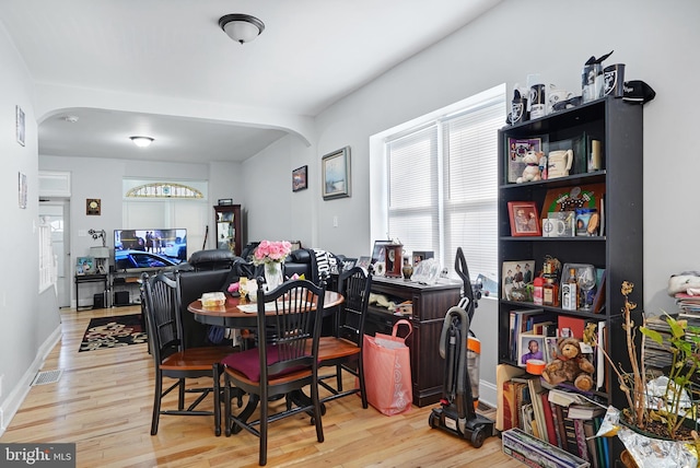 851 Carl Miller Blvd, Camden, NJ 08104 - dining room with arched walkways, wood finished floors, and baseboards