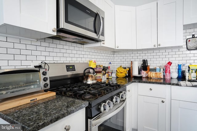 851 Carl Miller Blvd, Camden, NJ 08104 - kitchen featuring stainless steel appliances, white cabinets, decorative backsplash, and dark stone counters