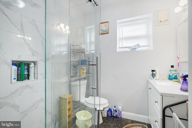 851 Carl Miller Blvd, Camden, NJ 08104 - bathroom with vanity, a stall shower, toilet, tile patterned flooring, and baseboards
