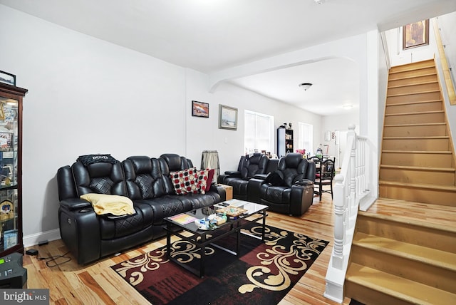 851 Carl Miller Blvd, Camden, NJ 08104 - living room with stairs, wood finished floors, arched walkways, and baseboards
