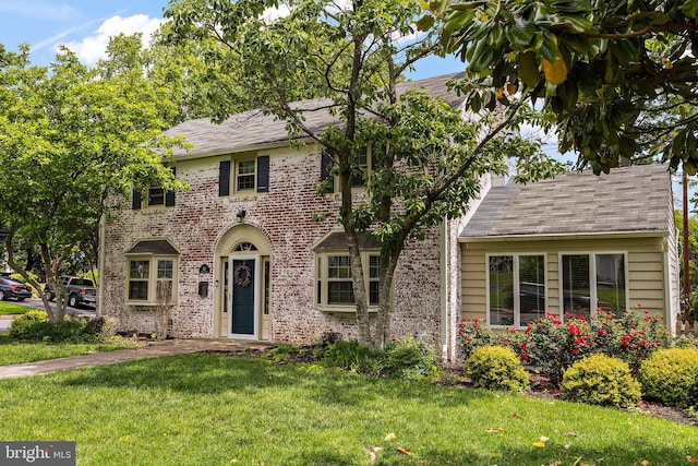 201 S Rd, Wilmington, DE 19809 - view of front facade with a front yard, a shingled roof, and brick siding