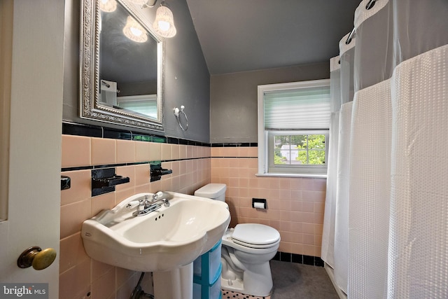 201 S Rd, Wilmington, DE 19809 - bathroom featuring toilet, tile walls, a shower with curtain, and wainscoting